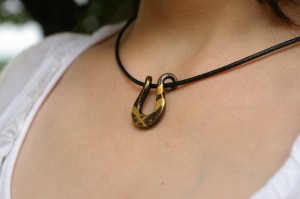 Japanese iron pendant with lacquer and gold