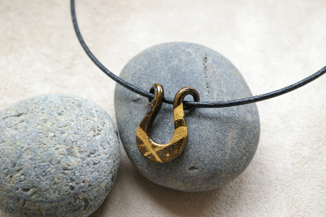 Japanese iron pendant with lacquer and gold