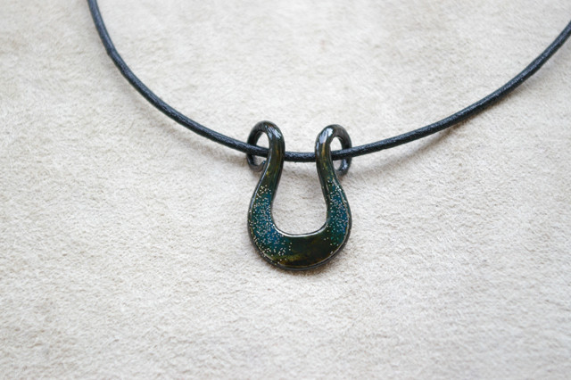 Japanese Horseshoe shaped blue necklace